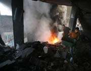 palestinians extinguish a fire after an israeli missile strike on a house in gaza