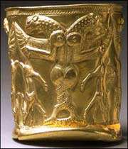 golden vase with winged monsters