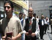 iranian people in queue for presidential elections