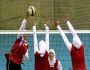 girls playing volleyball