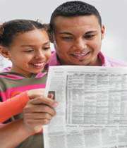 father and kid reading news