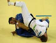 blue-clad iranian judo practitioner arash miresmaili entered the quarterfianls in gunangzhou asian games.