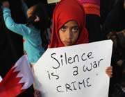 this file photo shows a youngster holding up a placard during an anti-government protest in bahrain’s capital, manama.