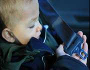 a file photo of a young kid in a vehicle