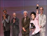 one of the winners holds his prize during the closing ceremony of the 13th international student theater festival at tehran’s city theater complex. 