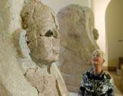 a museum visitor looks at a hittite sphinx in berlin