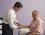 doctor examining arthritis patient 