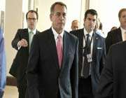 speaker of the us house of representatives john boehner (center) returns to his office after a media briefing in washington.