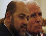 chief fatah negotiator in reconciliation talks azzam al-ahmed, right, and hamas leader mussa abu marzuq, left, look on during a news conference in cairo, egypt. 