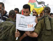 israeli troops push back palestinians at a demo calling for palestinian statehood in the west bank.