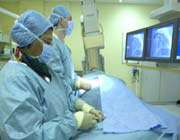 cardiologists performing a coronary angiography procedure