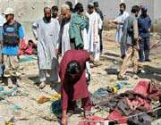 people gather at a scene of bomb blast in afghan province of kandahar. 