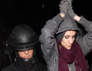 a protester is forcibly removed from jamison park in portland.