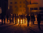 residents of ercis stand near a fire on a street after an earthquake in the eastern province of van.