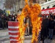 protesters shout slogans as they burn a us flag during an anti-america protest after the friday prayers in istanbul on december 2, 2011.