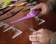 the replica is about one-eightieth the original size and is marketed as a toy carrying a $4 price tag.