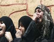 relatives of palestinians killed in israeli airstrikes grieve during in gaza city, march 11, 2012.