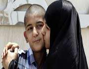 ali hassan meets his mother on his release, june 11, 2012.