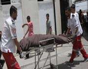 palestinians wheel the body of	a man killed in the israeli airstrike on rafah on june 20, 2012.