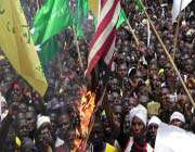 protesters burn a us flag during a demonstration in the city of kaduna in nigerias mainly muslim-populated north against a us-made film