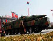 a north korean vehicle carrying a new missile passes by during a mass military parade in pyongyang