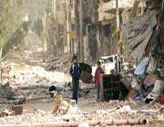 children walk amid rubble in an unknown location in syria.