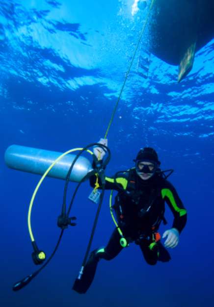 Diver with additional tank, Cuba