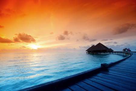 maldivian houses on sunrise