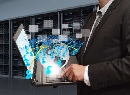 business man holds laptop computer and social network in server