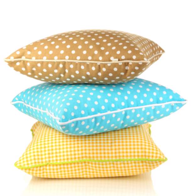 Blue, brown and yellow bright pillows isolated on white