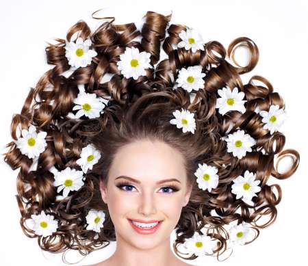 Smiling woman with flowers in hair