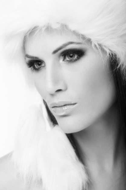 Winter portrait of woman in fur cap