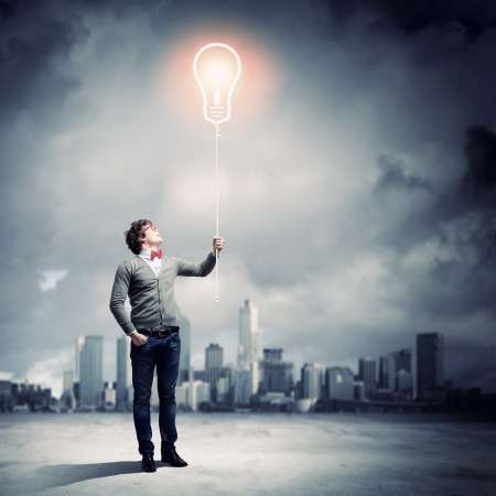 Young man holding a light