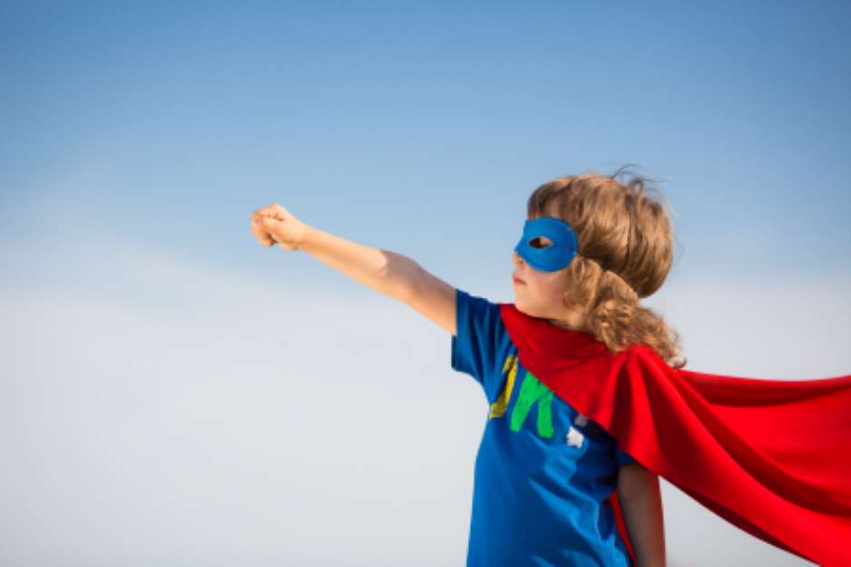 Superhero kid. Girl power concept