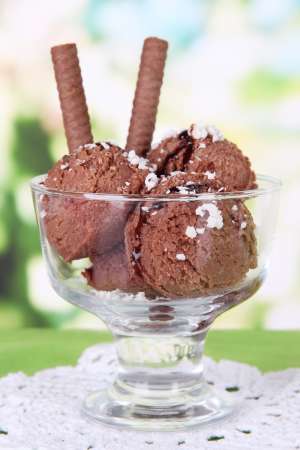 Delicious ice cream on table on bright background
