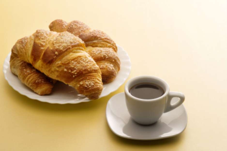 Cup of coffee with croissants