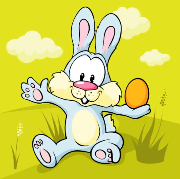 easter bunny sitting on green grass holding egg
