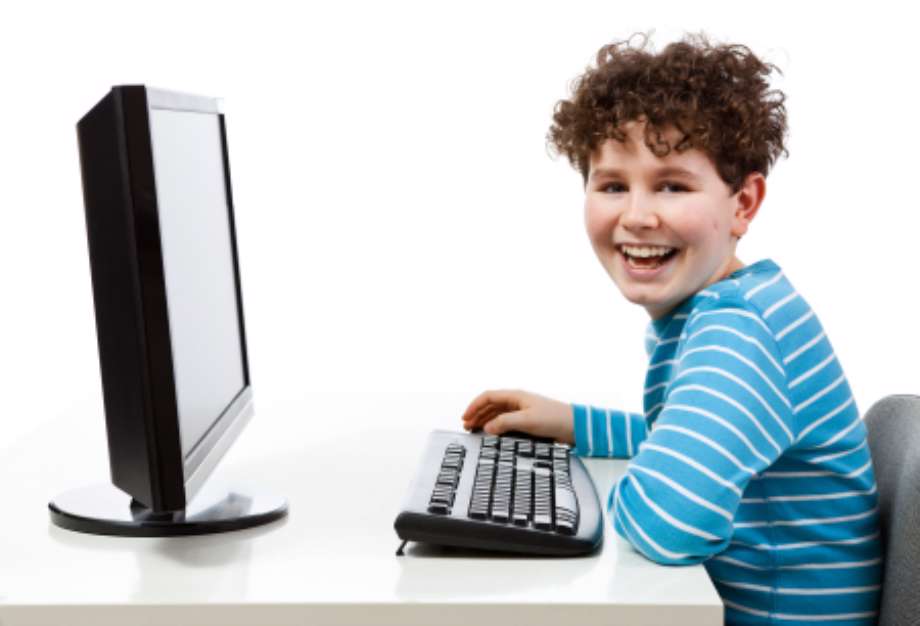 Boy using computer isolated on white background
