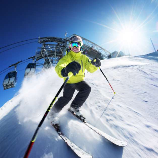 Skier on pise in high mountains