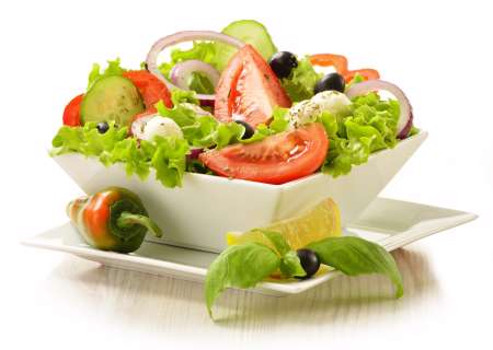 Vegetable salad bowl isolated on white