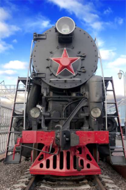 Old steam locomotive against blue sky