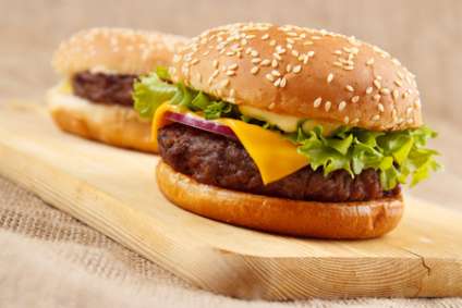 Homemade grilled hamburgers on wooden board