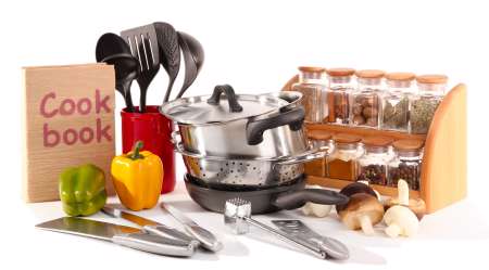 composition of kitchen tools,spices and vegetables isolated