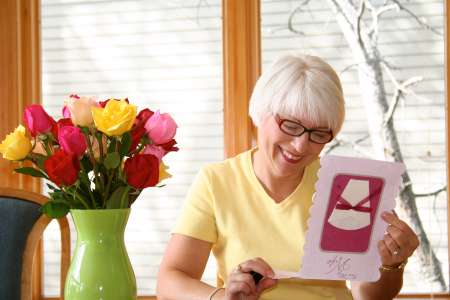 Woman with flowers and card
