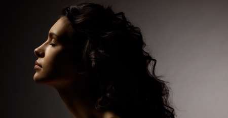 woman profile on black background