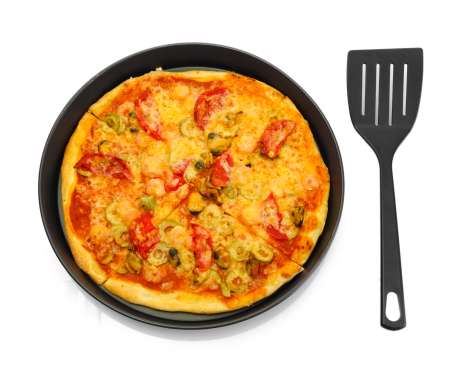 Delicious pizza with seafood in the frying pan isolated on