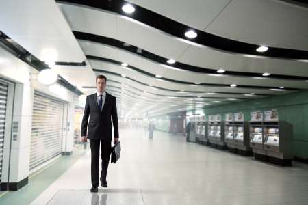 business man walking in subway