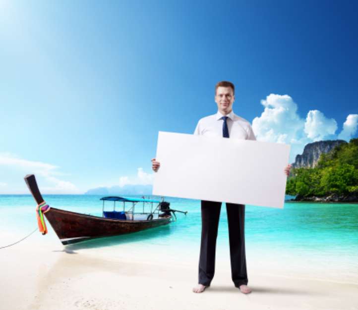 man on the beach of Thailand whith empty board in hand