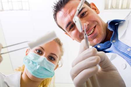 dentist and dental assistant
