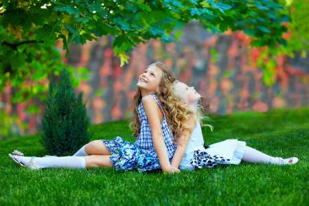 beautiful girls sisters enjoying colorful nature, outdoors